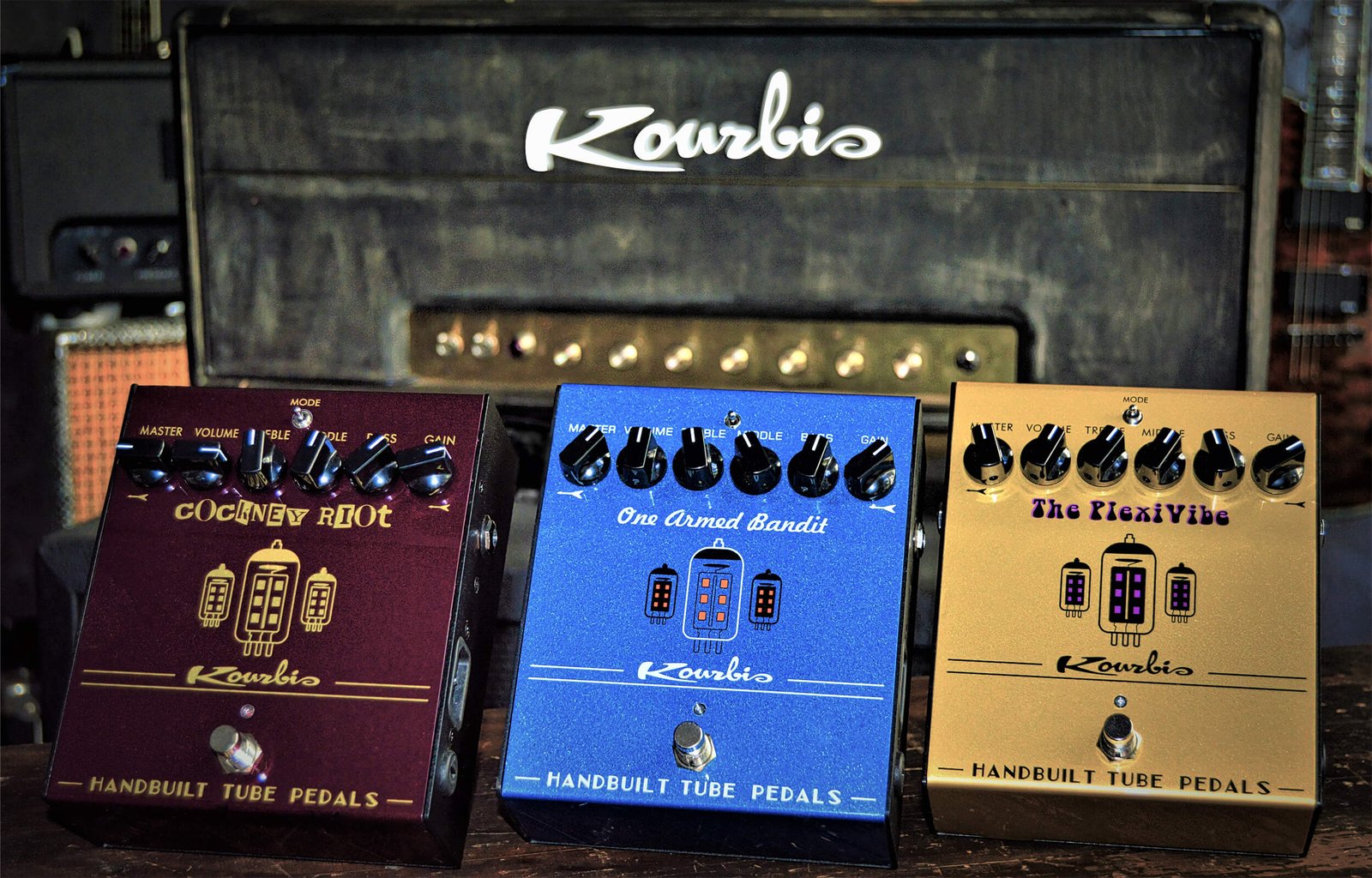 12ax7 tube preamp pedals, gold, blue, and burgandy, hand paint,in front of custom kourbis tube amp